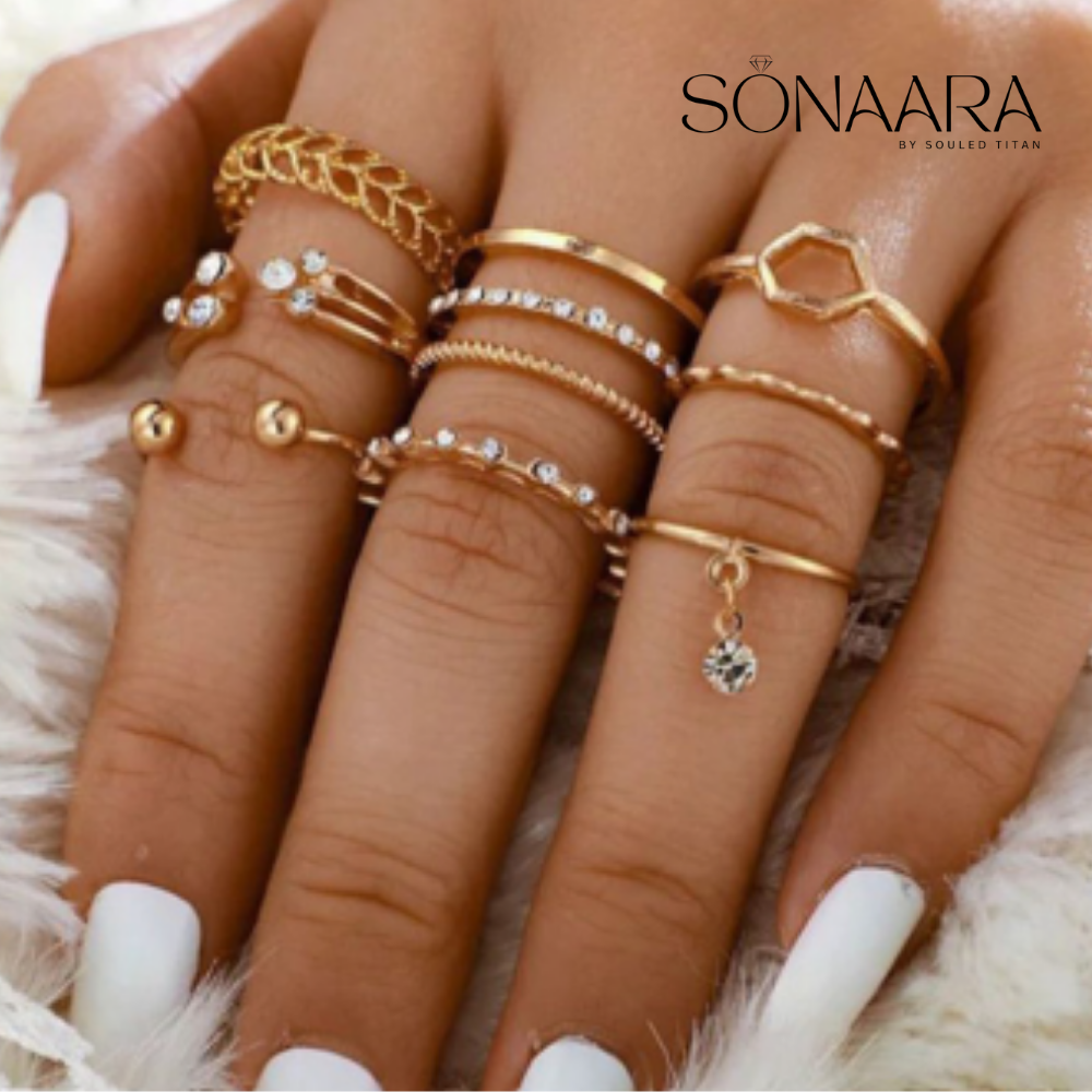 Multiple gold rings on fingers with 'Sonaara' branding.