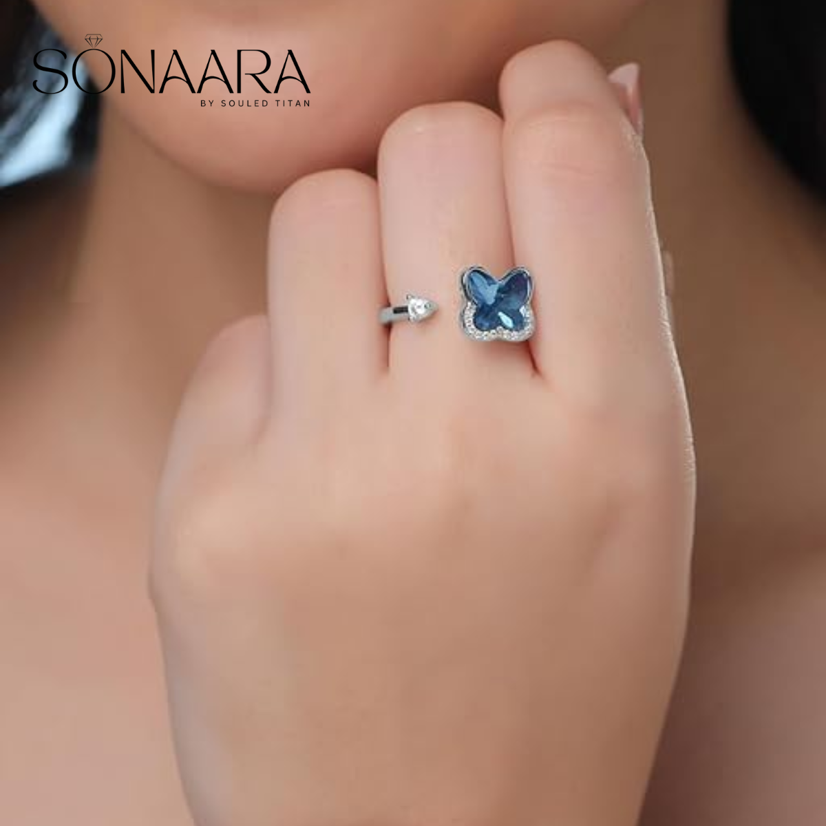 Blue stone studded ring worn by a woman