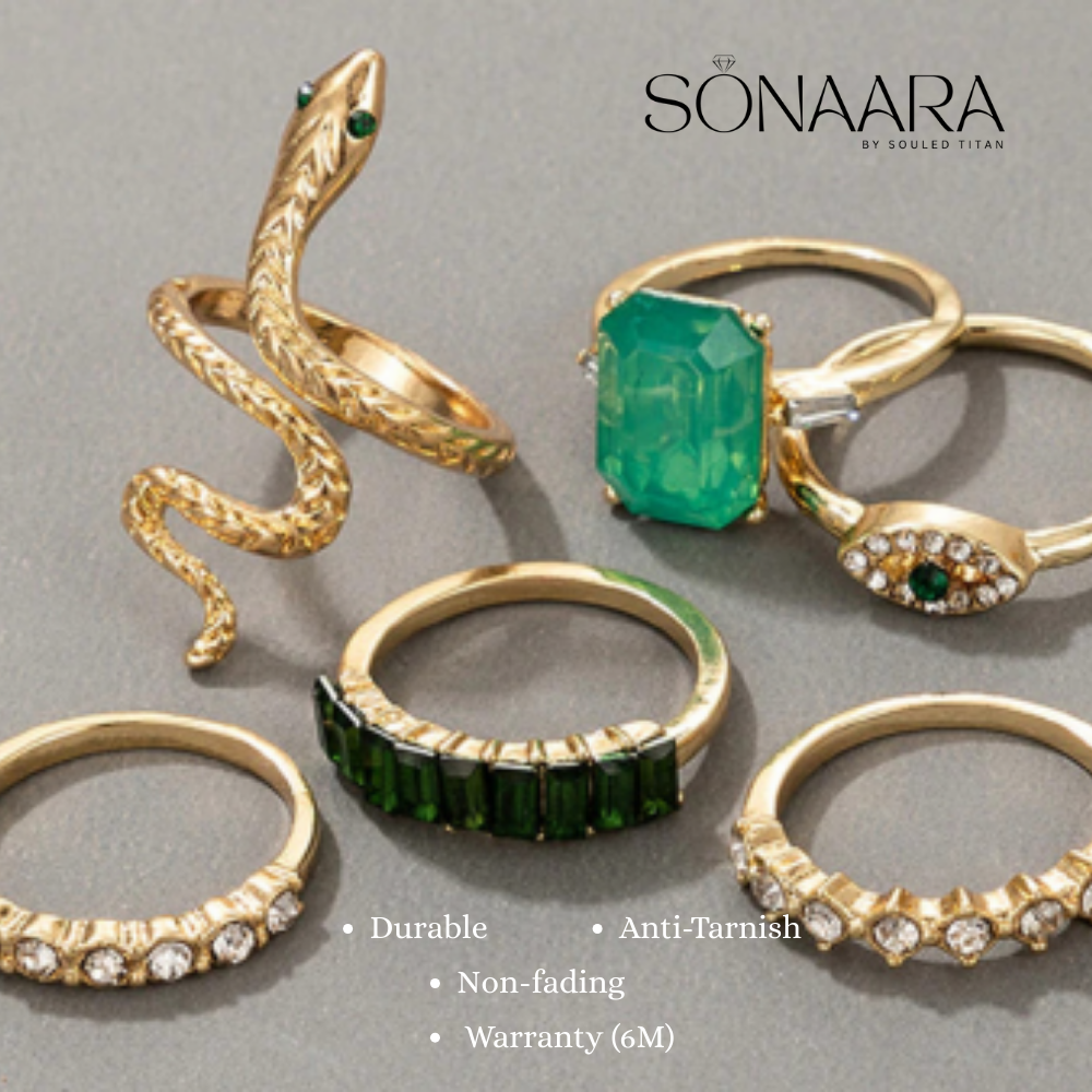 Gold and green gemstone rings on a gray background with Sonaara branding.