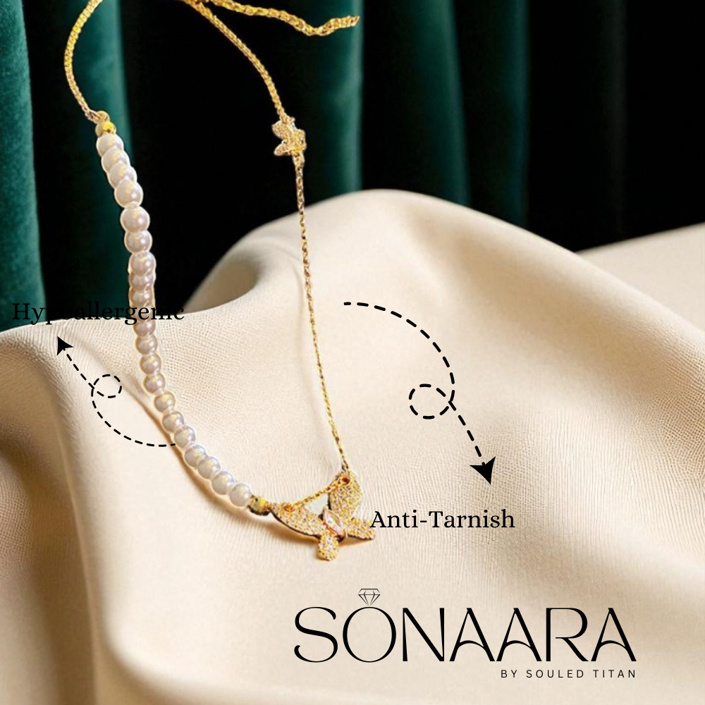 Necklace with star pendant on a beige fabric background, featuring Sonaara branding.