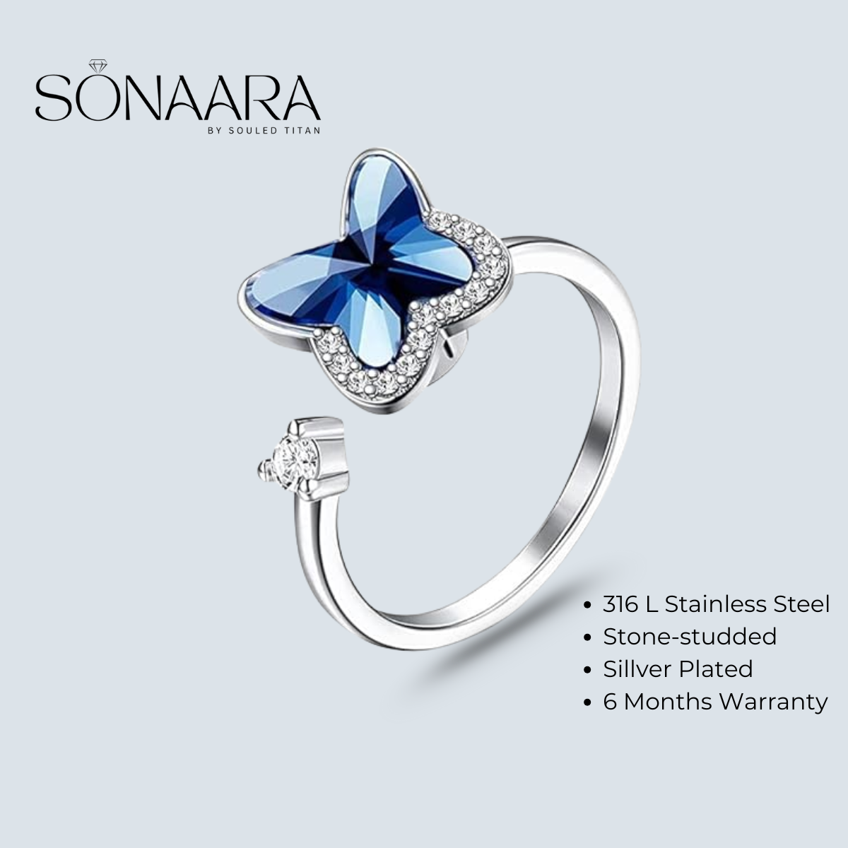 Butterfly-shaped ring with blue gemstone and silver plating on a light gray background, branded 'Sonaara'.
