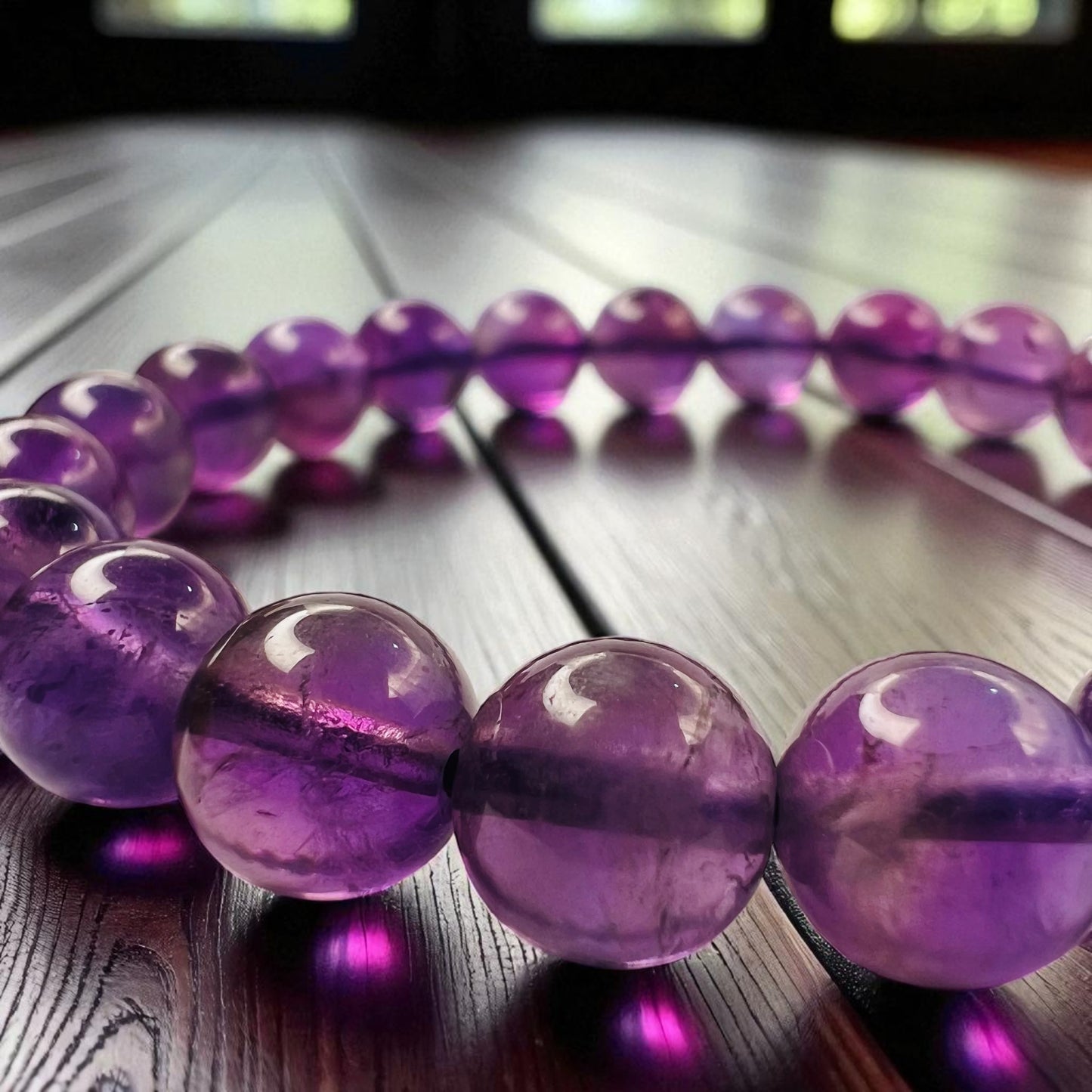 Purple Amethyst bracelet close look on a wooden surface
