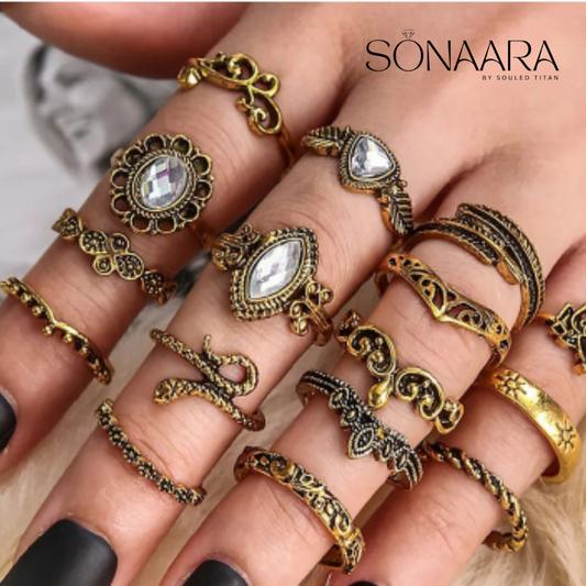 Hand wearing multiple gold and bronze rings with 'Sonaara' branding.