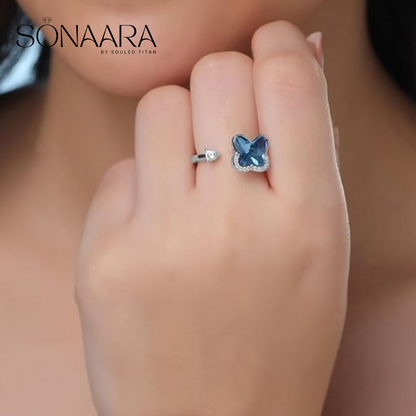 Blue stone studded ring worn by a woman 