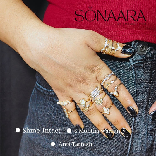 Hand wearing stone embedded stackable rings with 'Sonaara' branding and product features listed.
