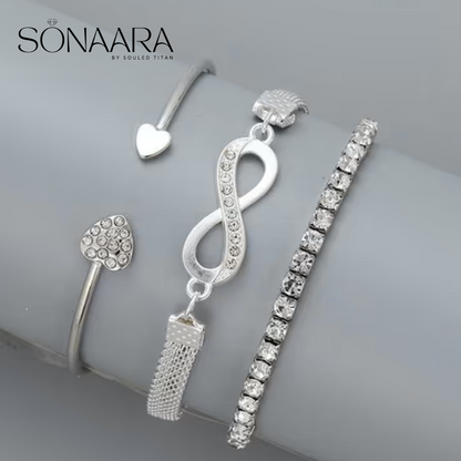 Silver jewelry set with 'Sonaara' branding on a gray surface