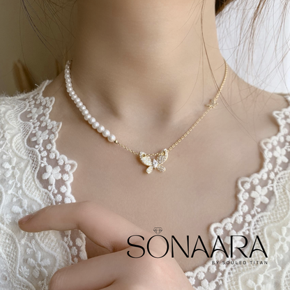 Pearl Butterfly Stainless Steel necklace with a butterfly pendant worn by a Girl on a lace garment, branded 'Sonaara'.
