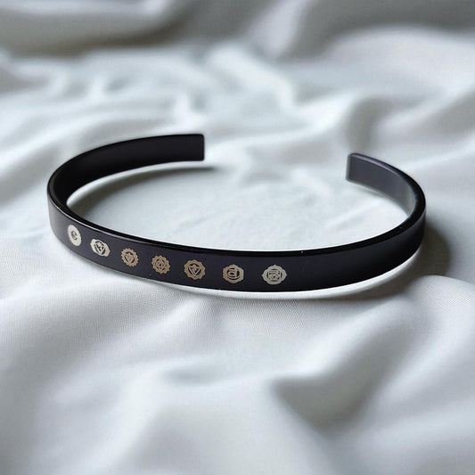 Black 7 chakra kada  wit IGP coating  laid on white velvet cloth