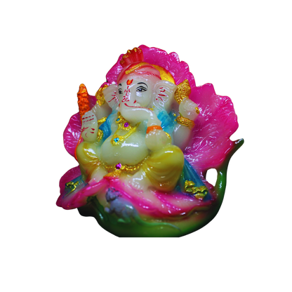 Colorful figurine of Ganesh on a white background sitting on a lotus flower