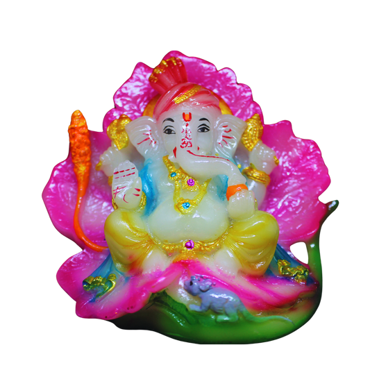 Colorful figurine of a Ganesha on a pink lotus with a white background