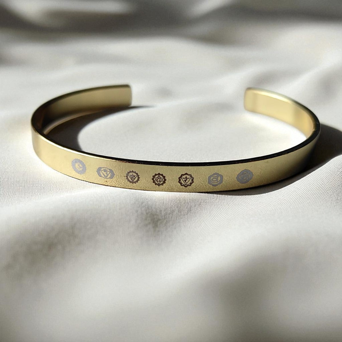 Gold 7 chakra kada placed the white fabric