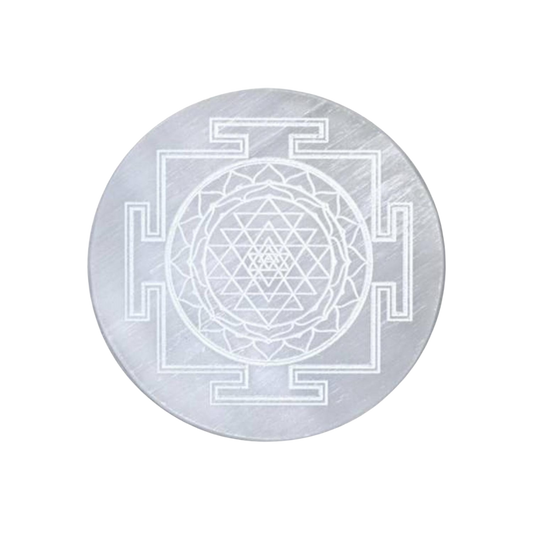 Circular Selenite plate with Sri Yantra design on a white background