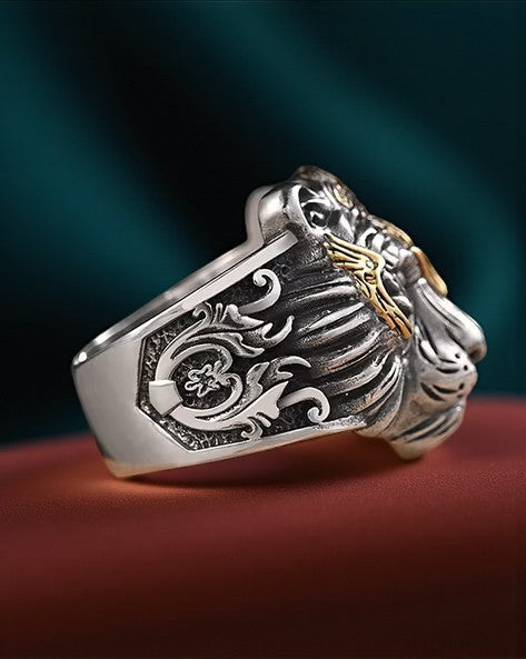 stainess steel ring  for men with intricate designs on a dark background