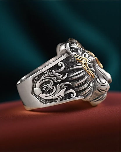 stainess steel ring  for men with intricate designs on a dark background